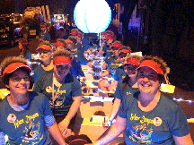 View of dragon boat team on the old Traditional-style Dragon Boat Float while lit up at night.